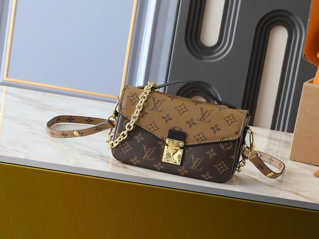 M46279 This small-size East West Messenger bag features a stylish shoulder bag d
