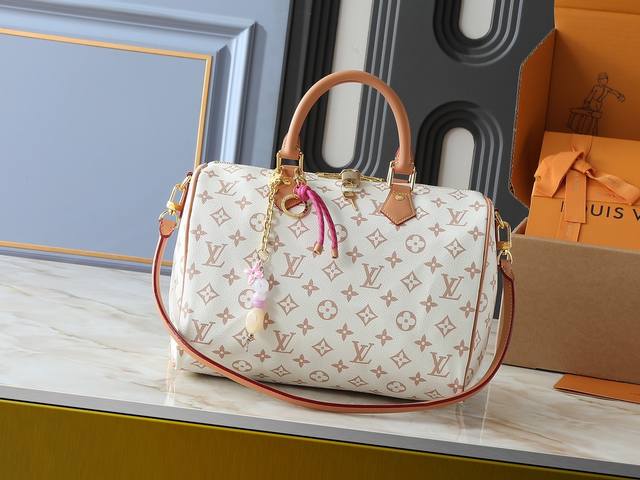 Upgraded from the original M15108 M40391, this Speedy Soft 30 Lucky handbag feat