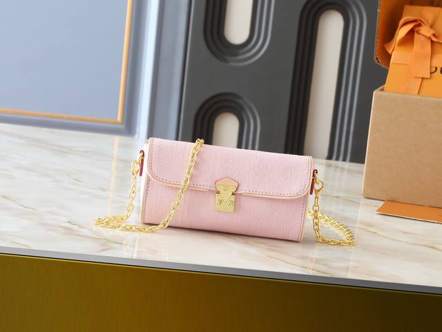 Updated from the original M13566, this Pochette Camille handbag is crafted from