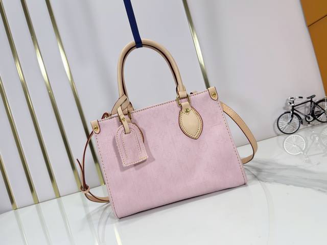 An updated version of the original M14633 M46373 blue denim square bag. This sma