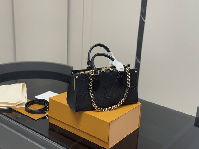 with folding box Size: 25.14cmlv Onthego horizontal shopping bag has a hidden sh