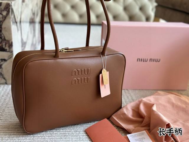 Includes box Size: 35*22cm. This Miumiu bowling briefcase is made of smooth, sof