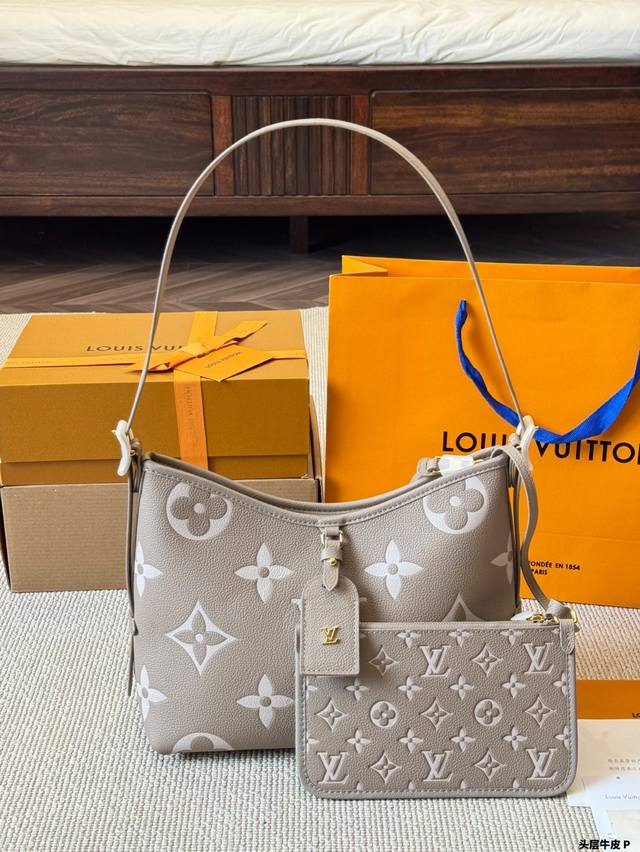 a new, top-grain cowhide Louis Vuitton Lv Carryall commuter bag. This stylish an