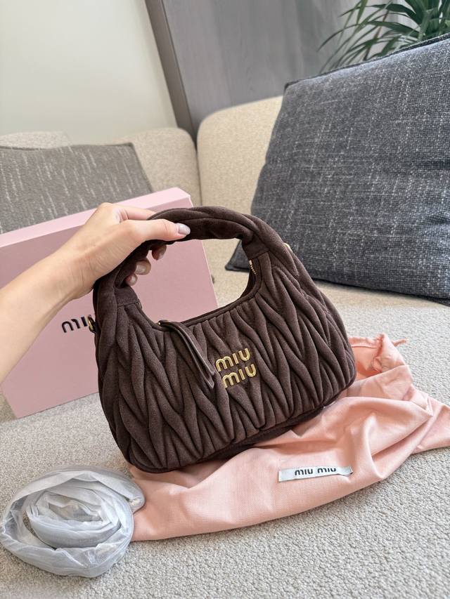 The original frosted suede Hobo crescent bag is in full swing. Miu Miu is out no