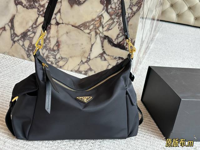 Everyone is pushing Prada bags. Prada's new nylon series Explore messenger bag.