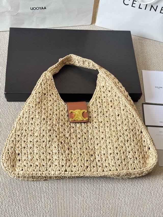 Celine is going on vacation with this loose straw bag. The Celine Cabas South of