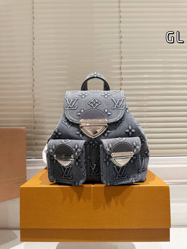 Lv embossed denim backpack 23
