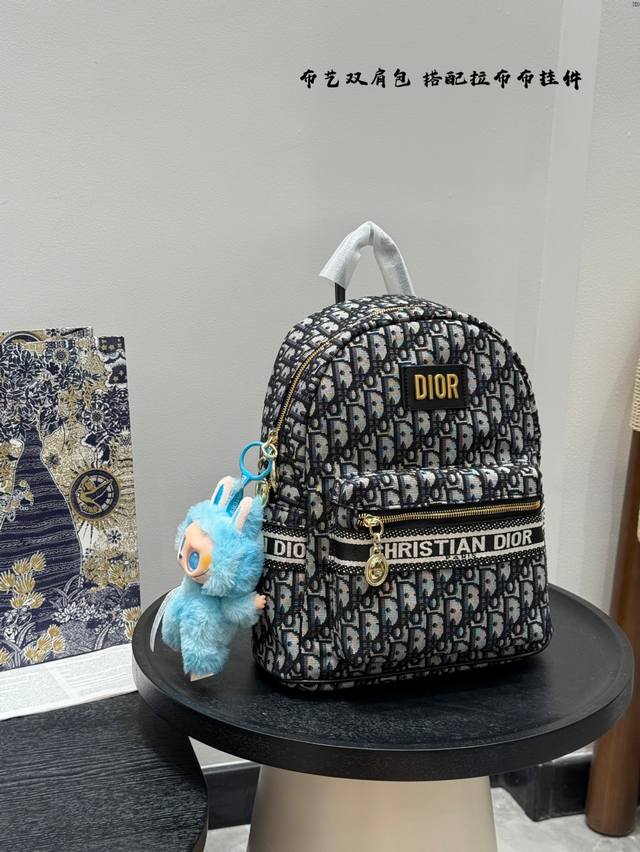 with a Dior Dior monogram fabric backpack with a pull-on cloth pendant. Unisex s