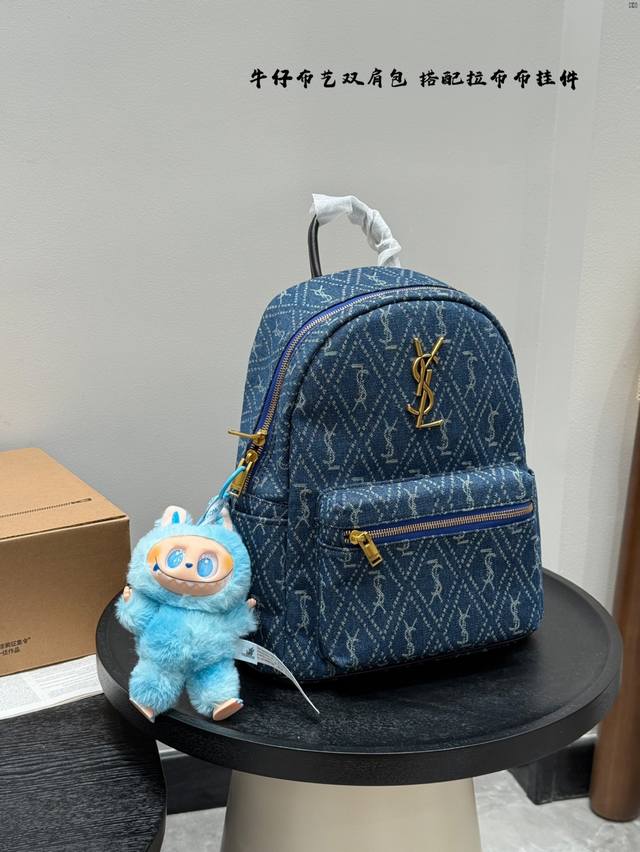 with a pull-on bag pendant YSL Saint Laurent denim backpack. Unisex style. Large