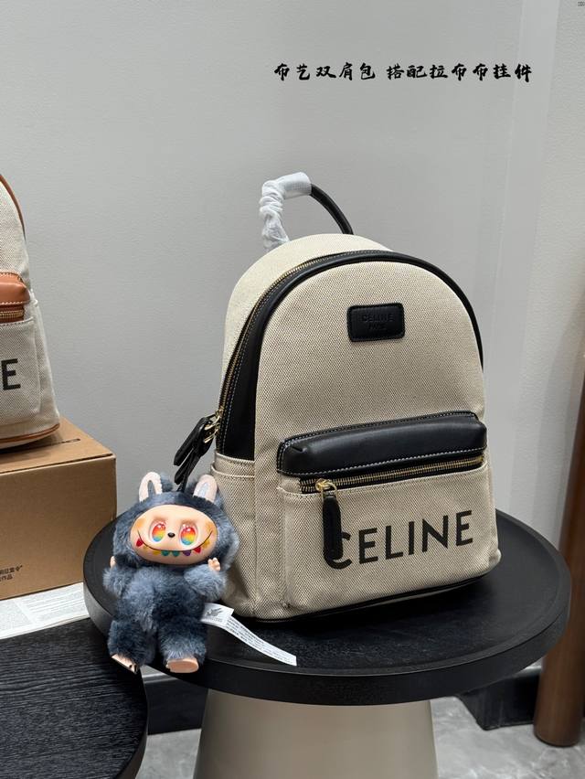 with a pull-on bag pendant. Celine canvas backpack. Unisex style. Large capacity