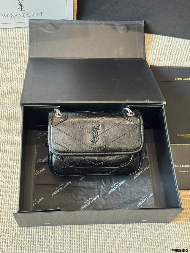 Cowhide Mini | Ysl Niki. It's incredibly spacious and can fit anything you need