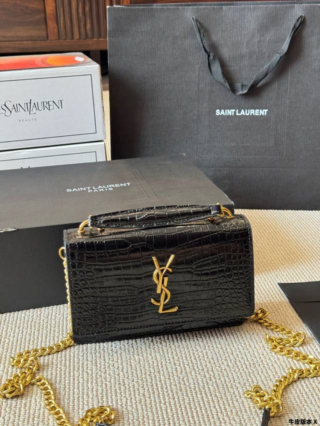 Crocodile pattern YSL classic sunset bag in black and gold. Very fashionable and