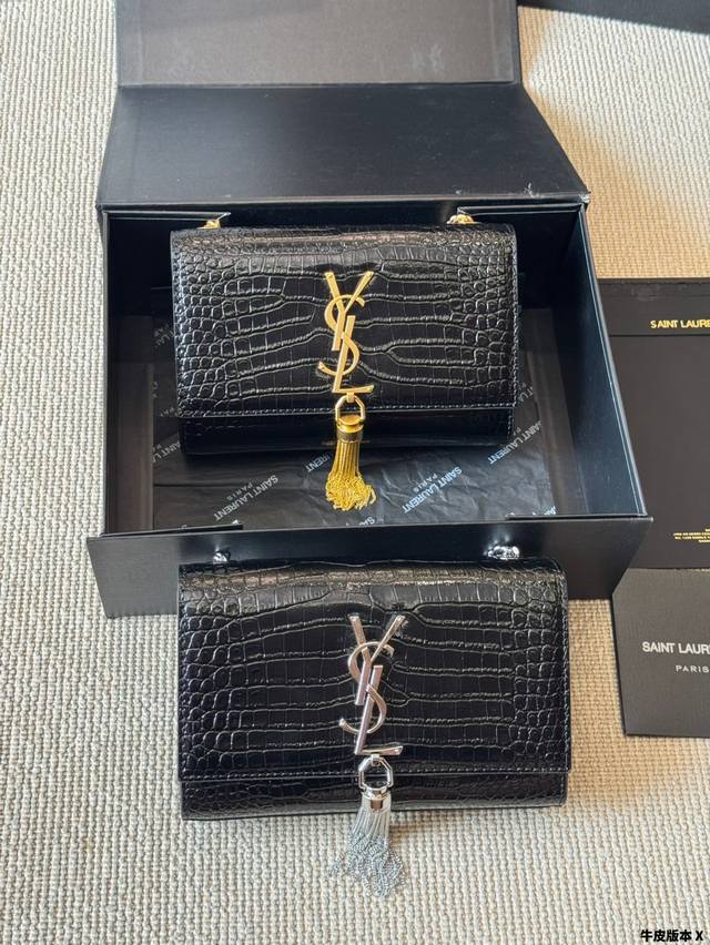 Crocodile pattern YSL classic Kate tassel bag in black and gold. Very fashionabl