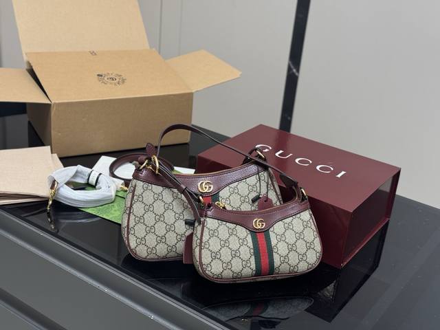 with folding box airplane box Gucci's Ophidia series monogram underarm bag is de