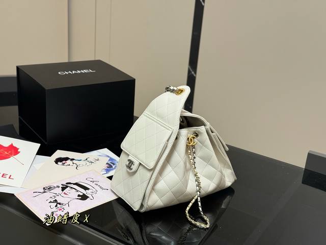 with folding case, Chanel 25 Bag. The small size is absolutely stunning. This ye
