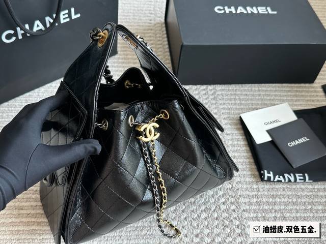 Two-tone hardware with a matching box. The small Chanel 25S Hobo is absolutely s