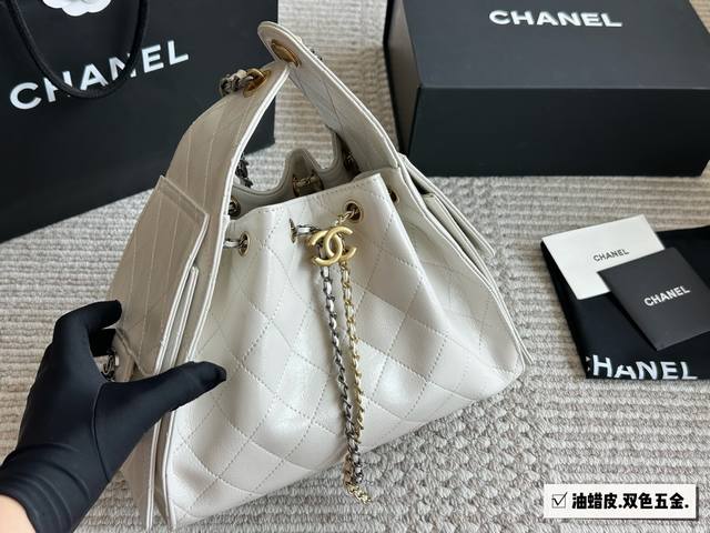 Two-tone hardware with a matching box. The small Chanel 25S Hobo is absolutely s
