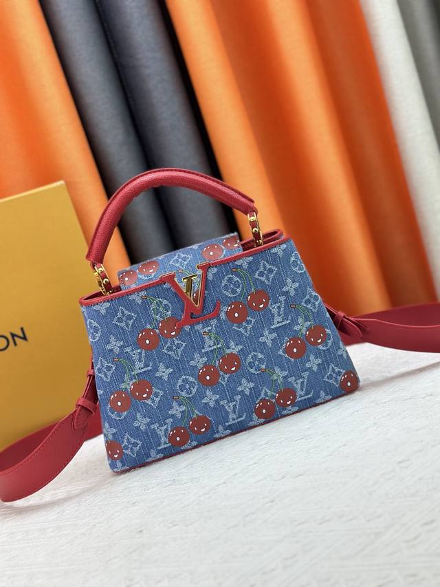 Exclusive photos of the Denim Cherry M59939 M94519 Capucines handbag. This Capu