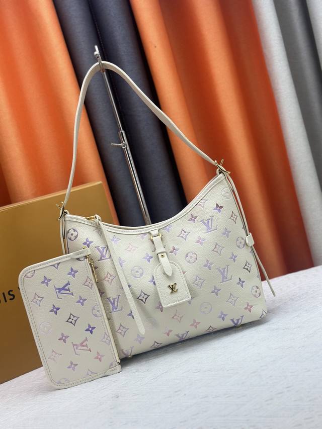 An updated version of the original Carryall Small Handbag (M46289, 46288, 46293