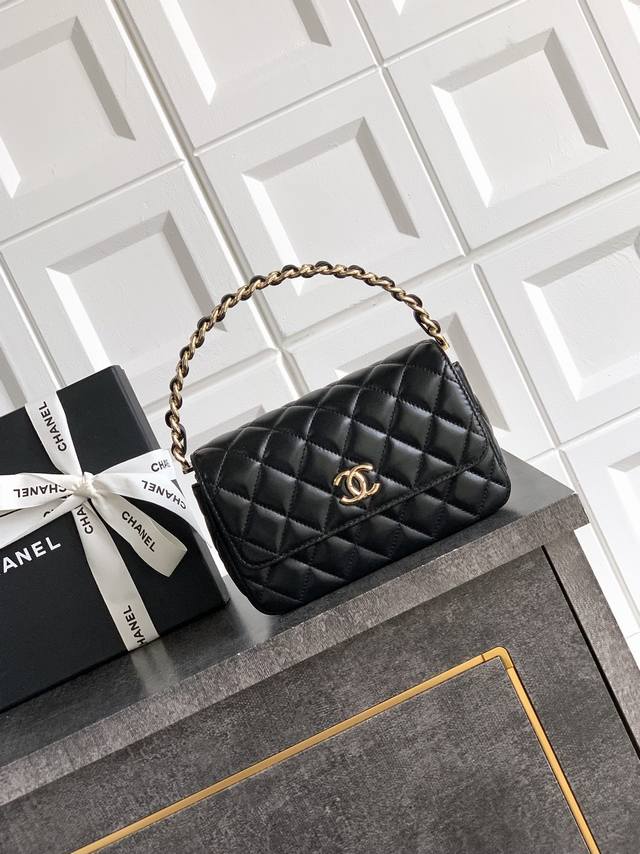 This is a super cute box bag in premium black sheepskin. I'm surprised they've