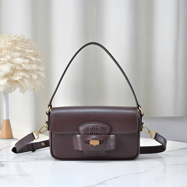 5Bd270: Miu M's new Penny gold coin bag. This handbag is inspired by the iconic