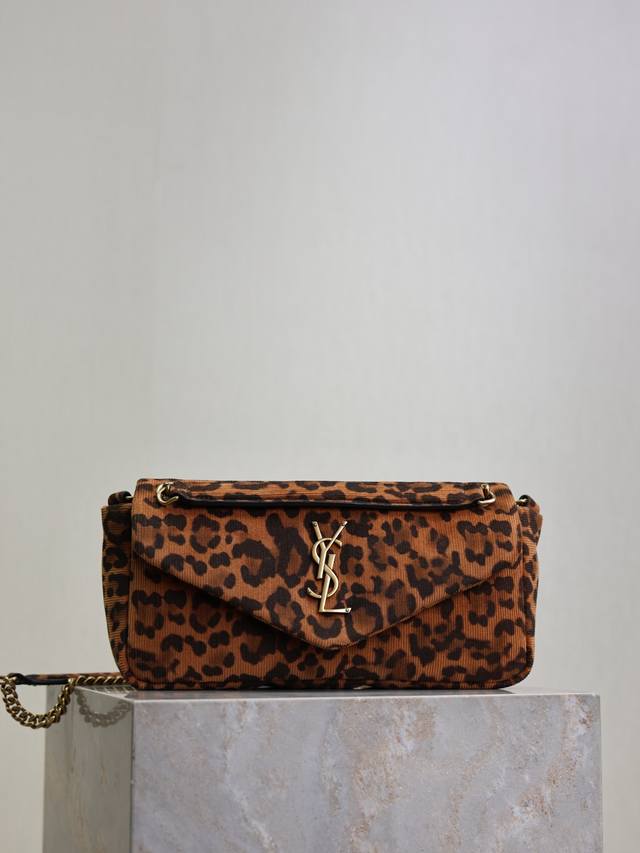 Calypso_Leopard Print Canvas with Gold BuckleThe classic Y logo, chain, and butt