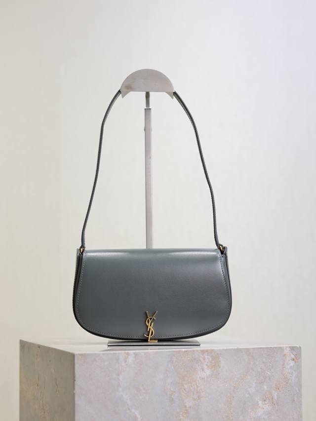 Gray The new Voltaire Mini underarm bag features a simple half-moon shape and a