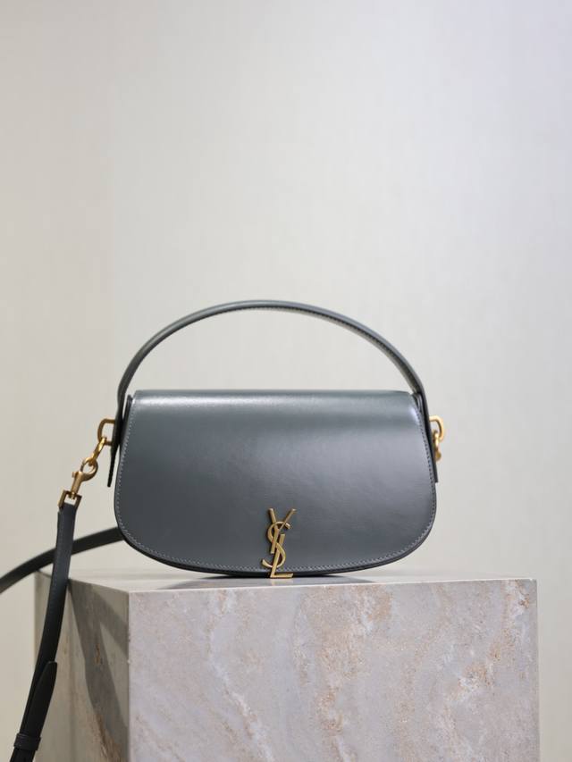 Gray Voltaire Crossbody Bag. The name comes from Voltaire, the French writer and