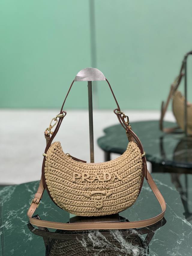 The new Woven Moon Bag features a curvaceous half-moon silhouette, enhanced by r