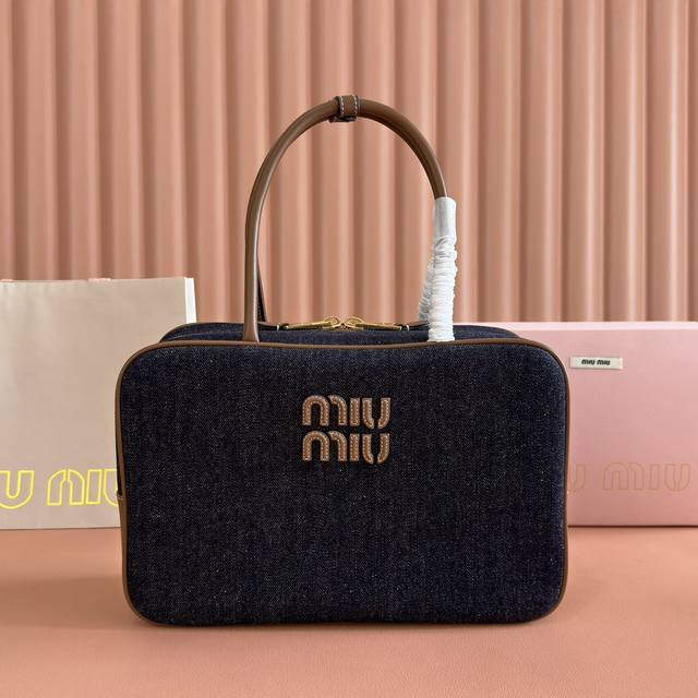Miumiu's original linen briefcase perfectly blends fashion and classic style, po