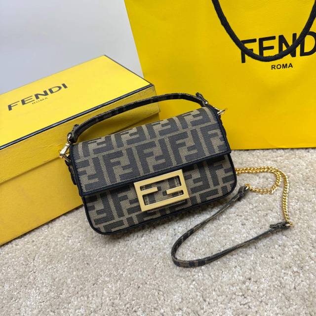 Fend1's signature medium Baguette bag features a flap with a magnetic Ff closure