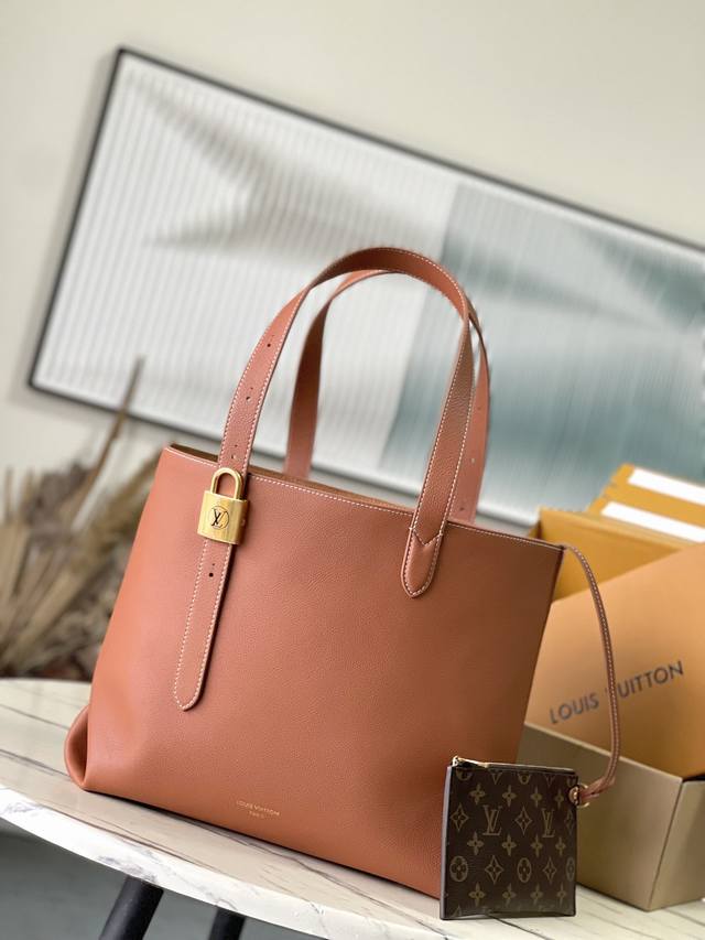 M25342, Caramel. This Low Key Cabas medium handbag is crafted from soft, grained