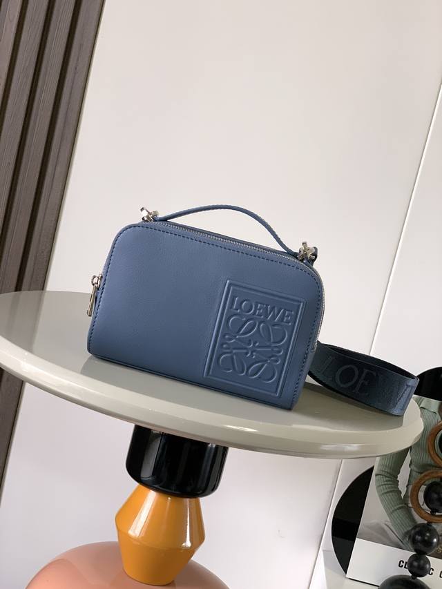 The satin cowhide leather mini camera crossbody bag meets your multi-functional