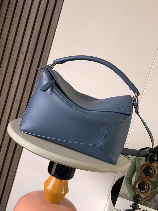 New shiny calfskin Puzzle-sized handbag. The Puzzle handbag is the first handbag