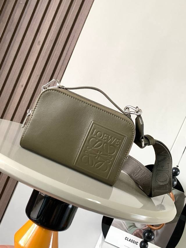 The satin cowhide leather mini camera crossbody bag meets your multi-functional