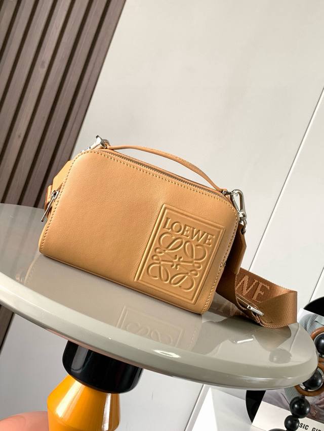 The satin cowhide leather mini camera crossbody bag meets your multi-functional