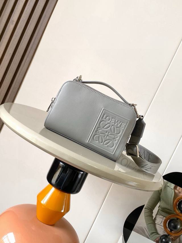 The satin cowhide leather mini camera crossbody bag meets your multi-functional
