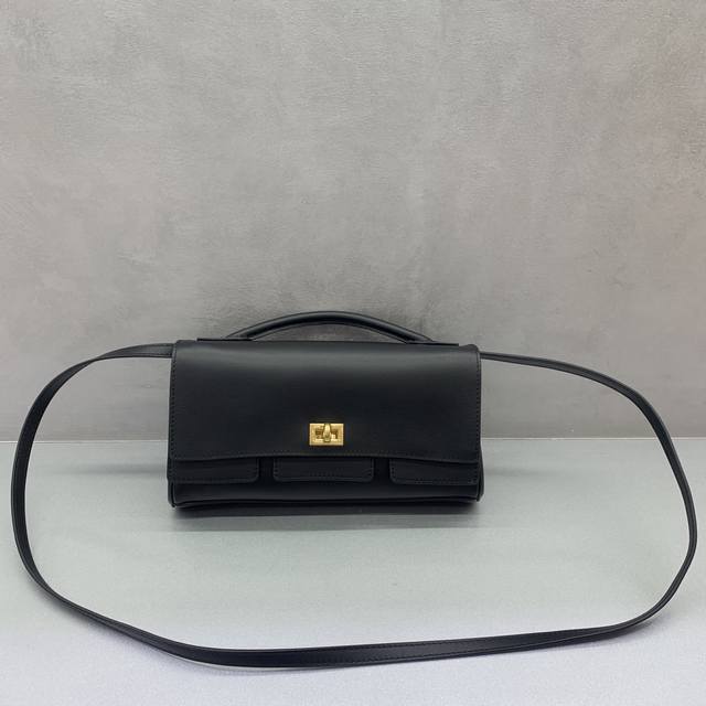 New Bel Air Clutch Flap Clutch in Black with Gold Buckle The Parisian brand, kno