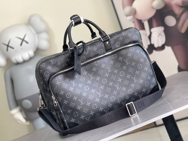 M11512 This Weekender bag, crafted from Monogram Eclipse canvas, is perfectly si