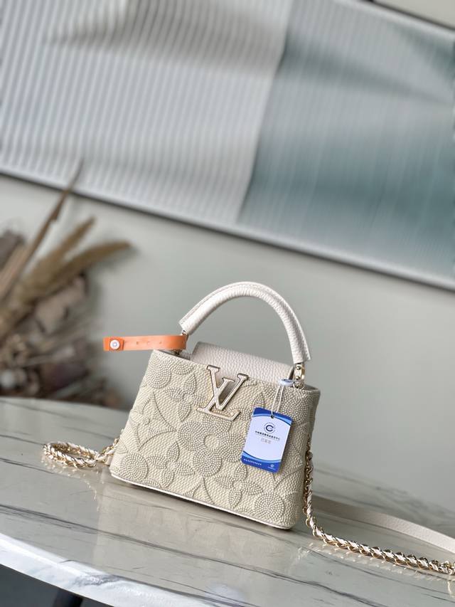 Premium Genuine Leather M14389 Mini This stylish Cacines bag is part of the "Ga