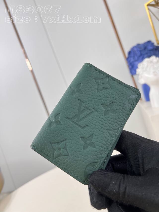 A top-quality, original, and genuine M83067 green pocket wallet. Made from full