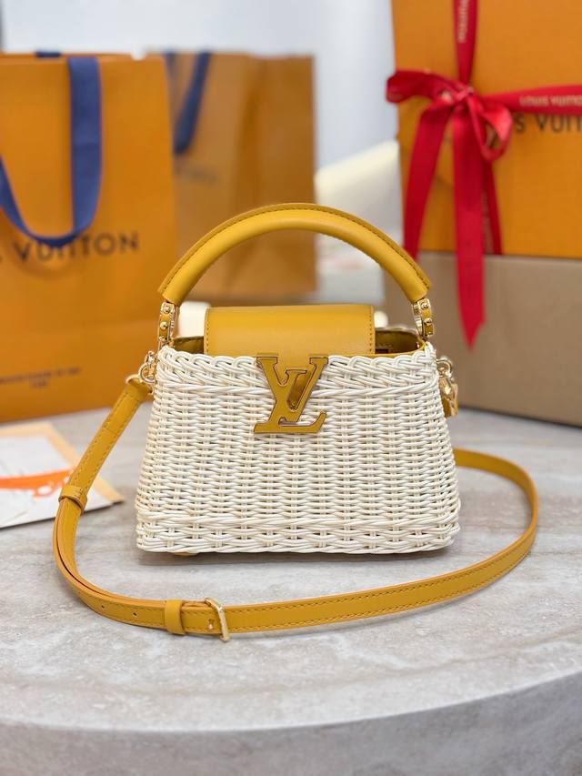 M24976 Mini Yellow This Capucines mini bag features a unique woven rattan design