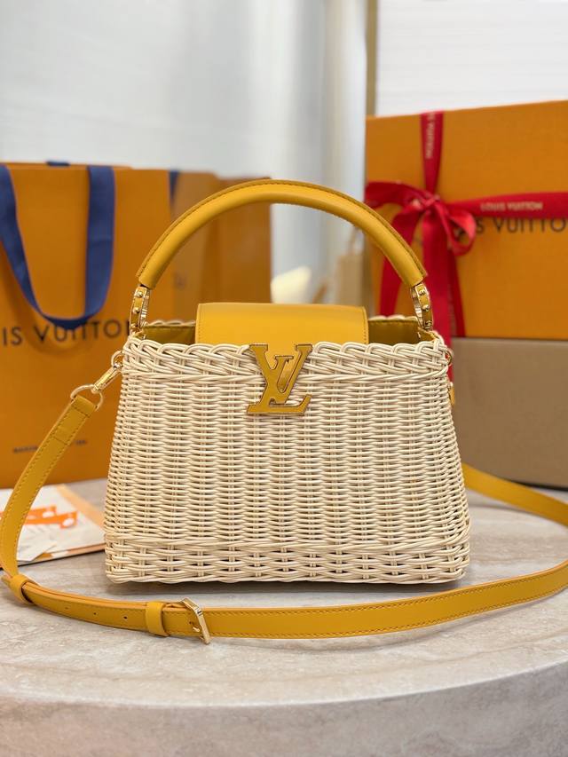 M24976 Small Yellow This Capucines Bb bag features a unique woven rattan design,