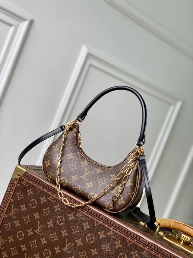 Top-grade original M25223 This Catchy small handbag features canvas with cowhid