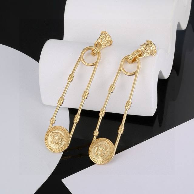 Versace large safety pin Medusa earrings are an accessory that cannot be ignored