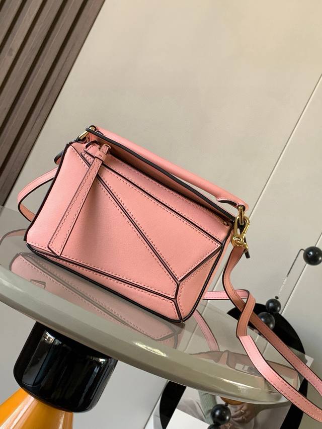 The popular geometric bag, the mini 18cm Puzzle handbag in imported nappa calfsk