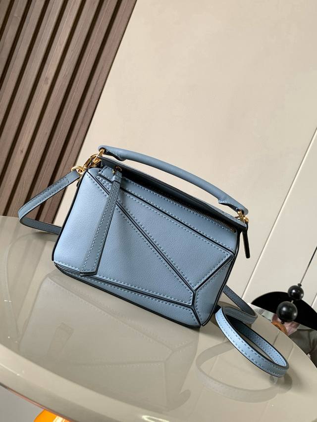The popular geometric bag, the mini 18cm Puzzle handbag in imported nappa calfsk