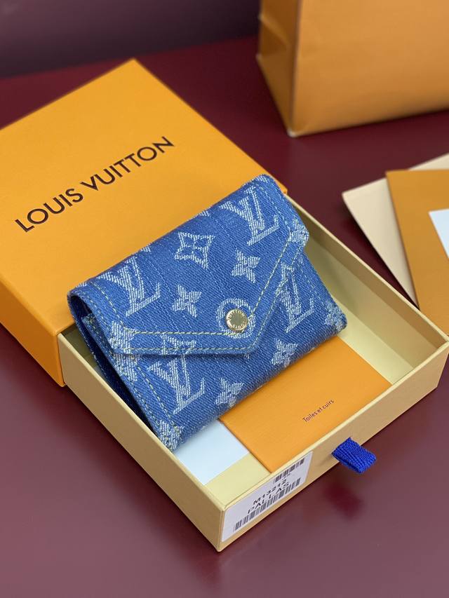 M13212 Denim! The Monogram Denim Victorine wallet features a vibrant blue design