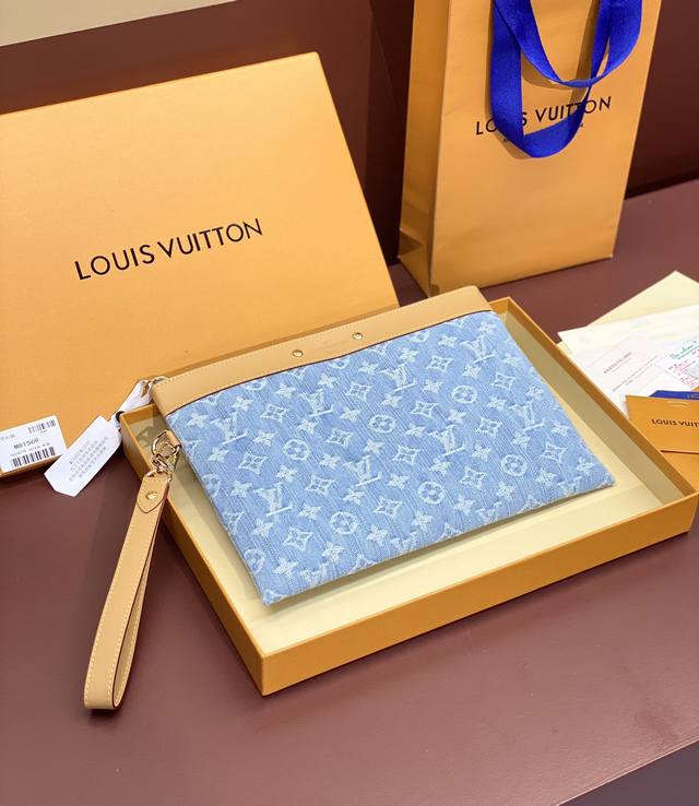 M81569 Blue! This Pochette To-Go clutch features Pharrell Williams' Damier Denim