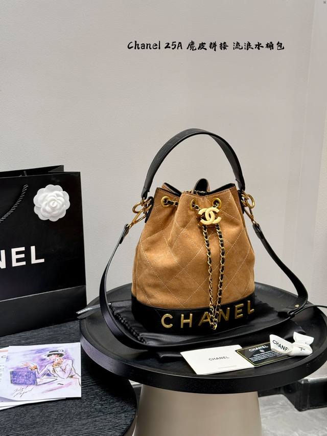 Comes with a gift box. Chanel's new suede-embellished bucket bag. It features a